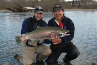 Angling Guide Ron Wakita, on the right, helping his client Mike pose this nice Steelhead landed with a fly